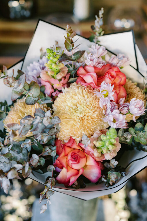 Closed Up Photo of Mixed of Bright Flowers and Lush Foliage