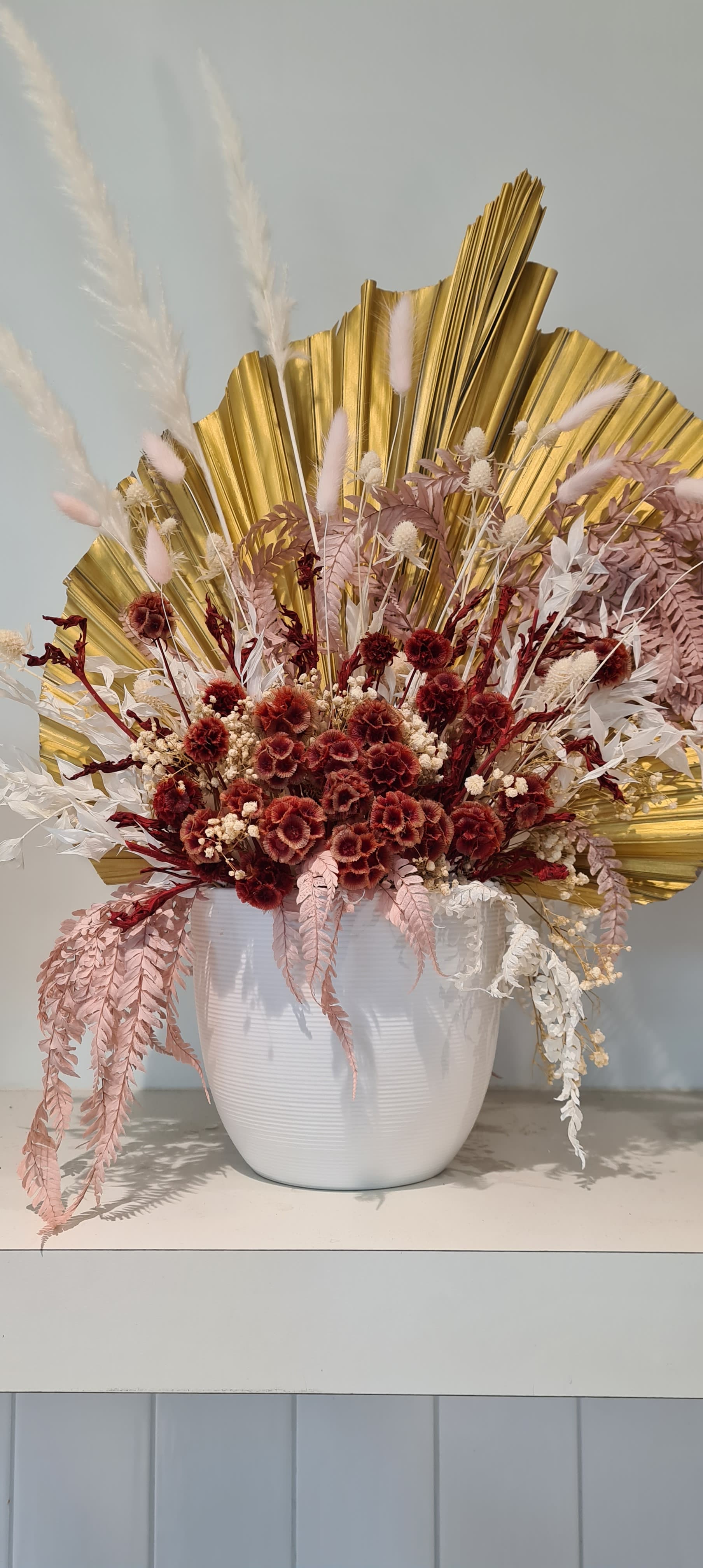 aesthetic red flower bouquet in a white vase
