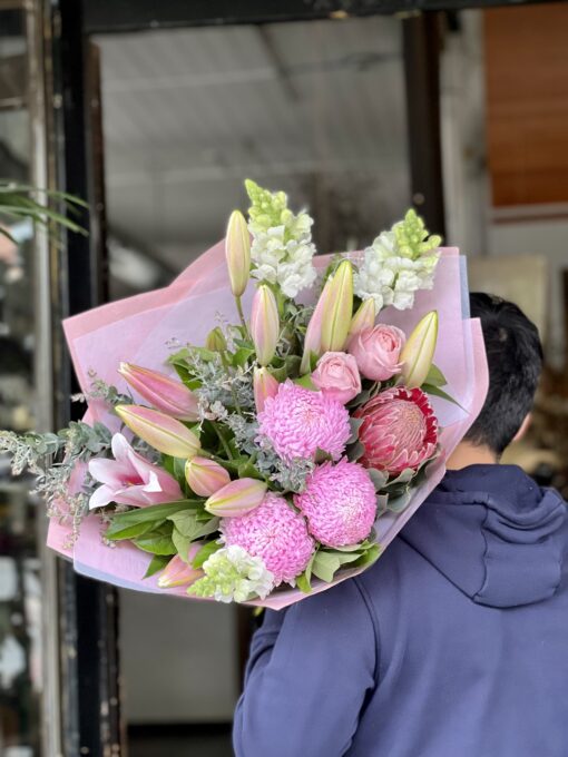 Man Carrying the Brings A Smile Bouquet