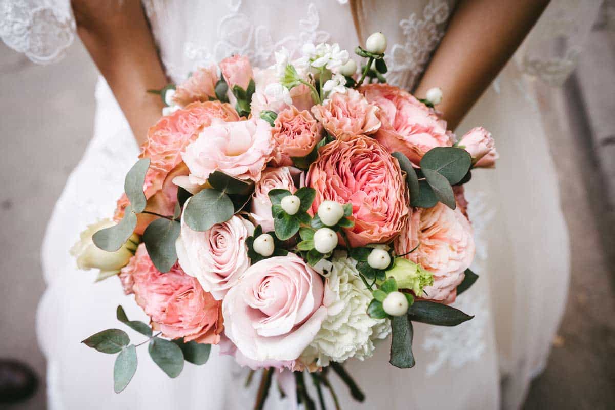 Bride Holding A Pink Bouquet of Wedding Flowers